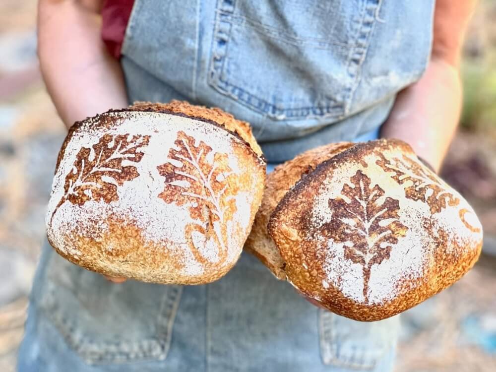 Person holding artisan bread
